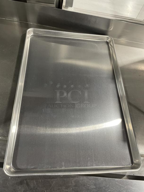 Brand new Advance Tabco full-size baking sheet pan, stainless steel, high durability, essential for commercial kitchens.