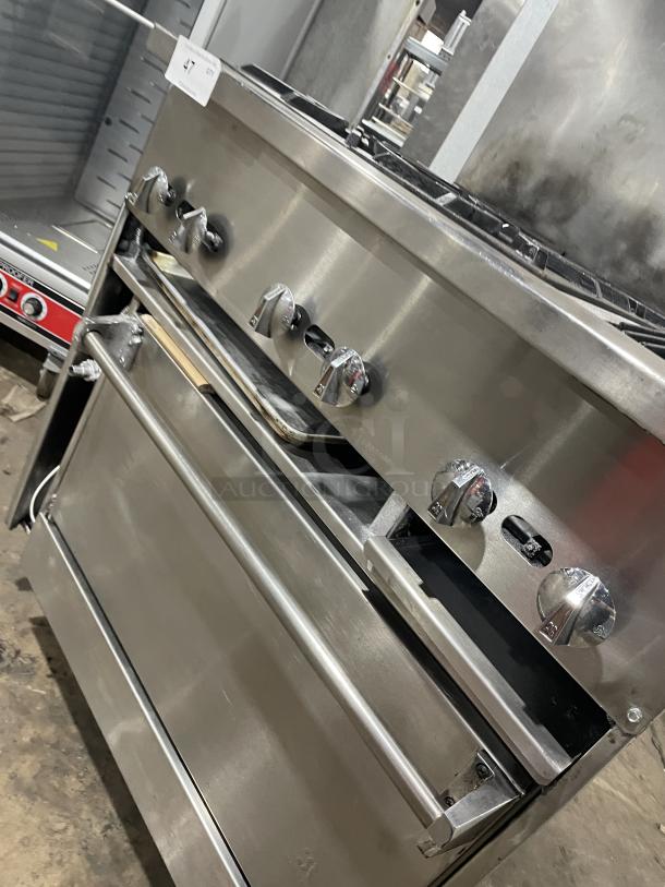 Jade Range gas-powered combo with 4 burners, char broiler, full-size oven, and raised backsplash, on casters.