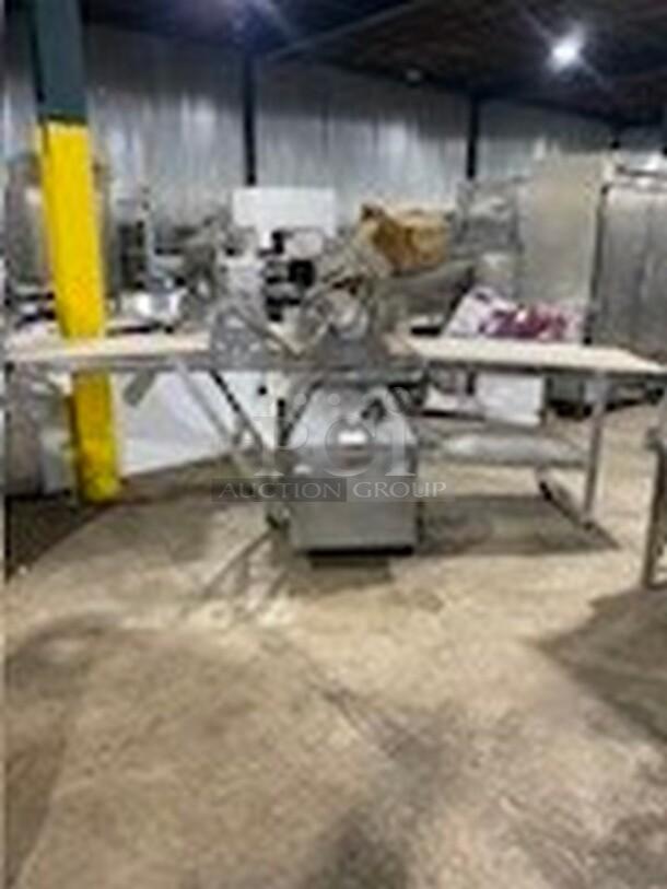 Moline floor-style heavy-duty commercial reversible dough sheeter with foot pedal, 3-phase, used but operational.
