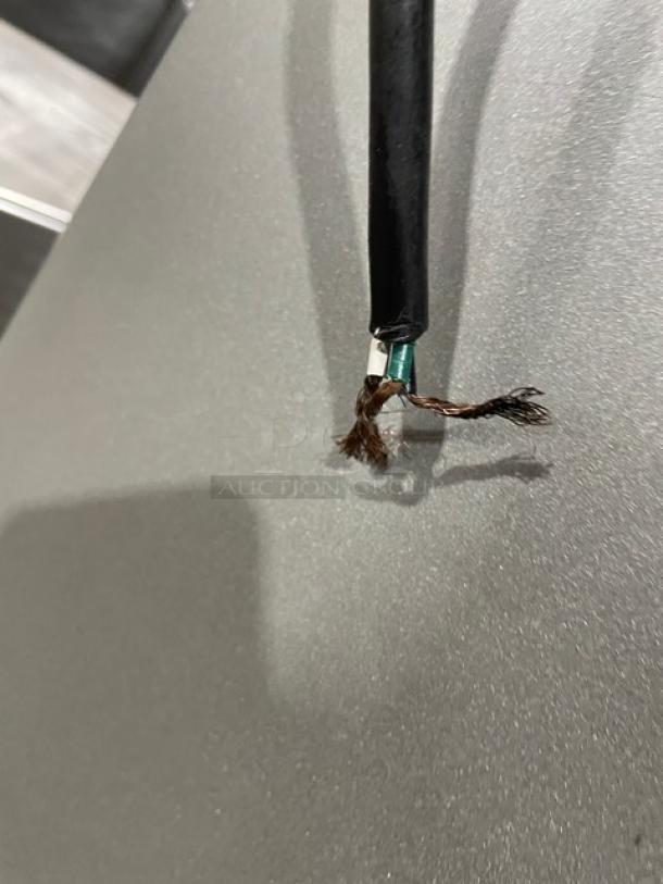 Univex SRM60+ 60 Qt planetary mixer with stainless steel bowl, wire whisk, and visible electrical cable damage. Model: SRM60+, SN: M0904018.