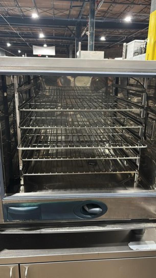 Rational SW62G natural gas combi convection oven on cart with pan rack, stainless steel, 208V 1 phase, on casters.