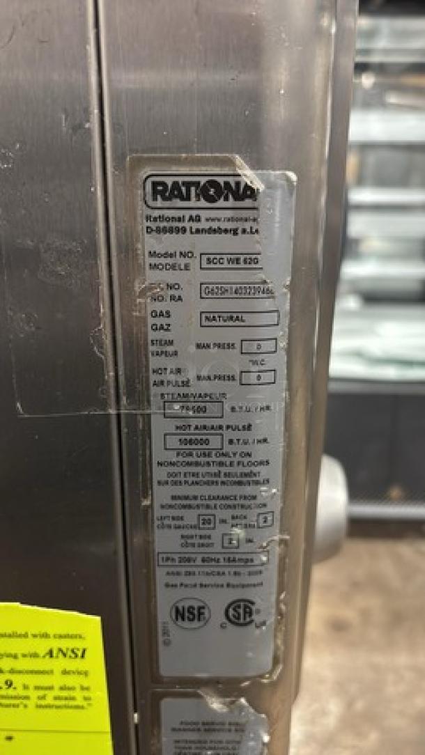 Rational SCCWE62G combi convection oven, natural gas, on cart with pan rack, casters. Model, serial, and specs shown.