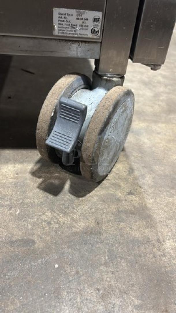 Rational SW62G combi convection oven wheel on caster; natural gas, 208V, 1 phase; includes built-in pan rack; good condition.