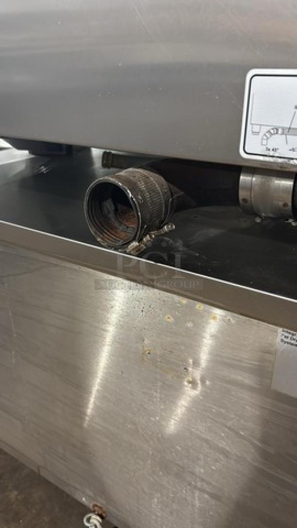 Rational SW62G combi convection oven in used condition, natural gas-powered, 208V, 1 Phase, on cart with pan rack and casters.