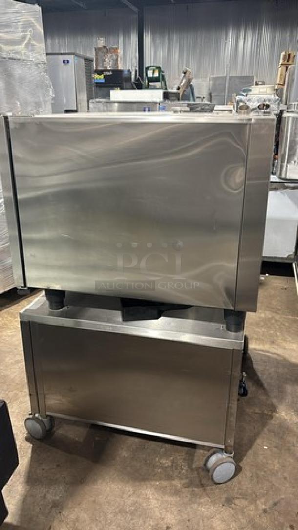 Rational Whit Efficiency Series Natural Gas Combi Convection Oven, Model SCCWE62G, on cart with pan rack and casters.