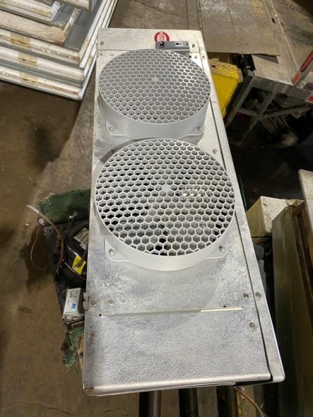 Mr. Winter 10'x10' walk-in cooler box with compressor and blower, professionally removed, featuring dual fan grilles in good condition.