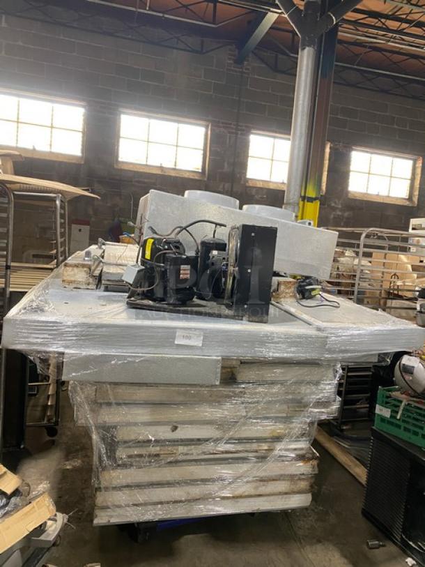 Mr. Winter 10' x 10' walk-in cooler box with compressor and blower, professionally removed, stacked and wrapped for auction.