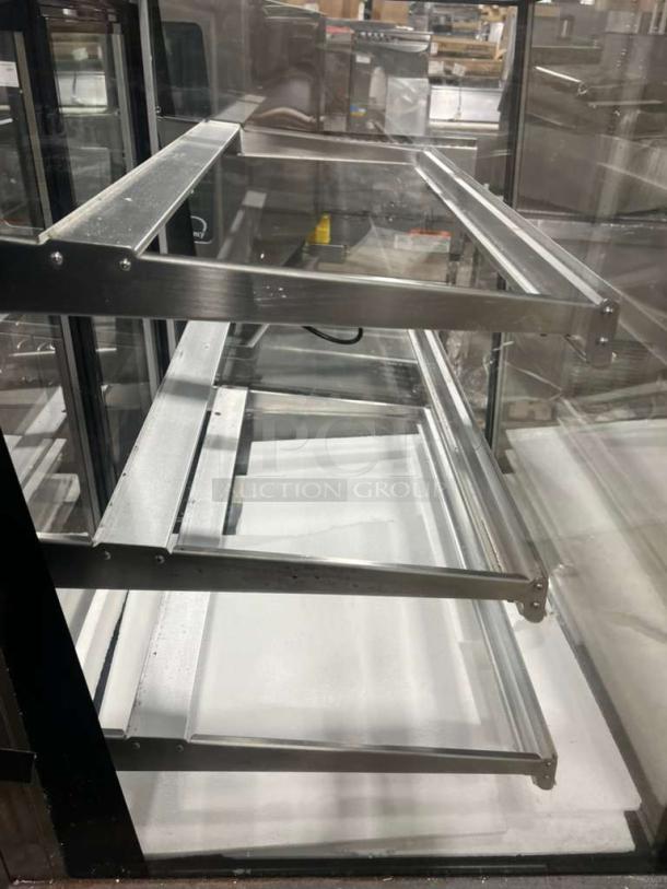 Marchia MBST36 3-tier refrigerated bakery display case, commercial grade, clear glass, metallic finish, 115V 1-phase.