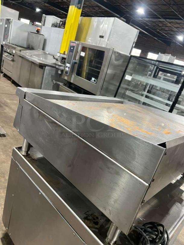 Garland GTGG36 commercial gas griddle with thermostatic controls on legs, showing moderate wear. Serial: 1709100101226.