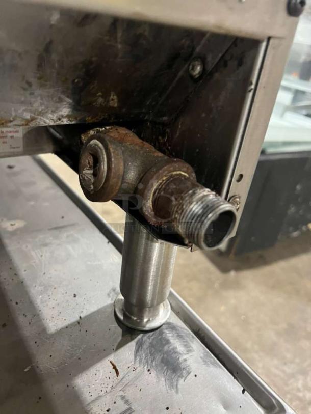 Garland GTGG36 commercial gas griddle, thermostatic controls, on legs, visible wear, model and serial numbers on unit.