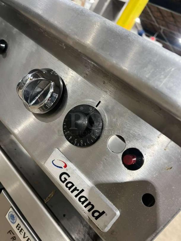 Garland GTGG36 heavy-duty commercial gas griddle with thermostatic controls, serial 1709100101226, on legs.
