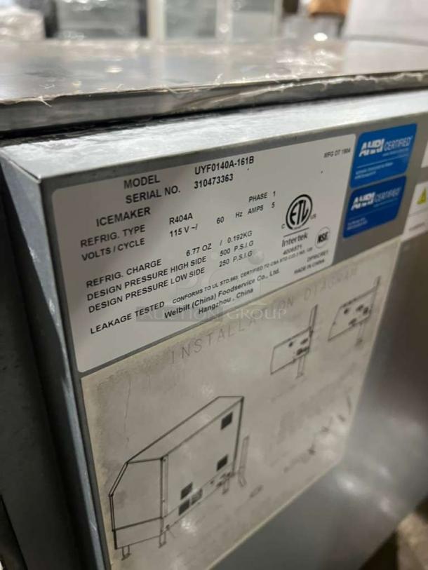 Manitowoc Under Counter Ice Maker Model UYGF0140A-161B, Serial 310473363, 115V, 1 Phase, visible label with specs.