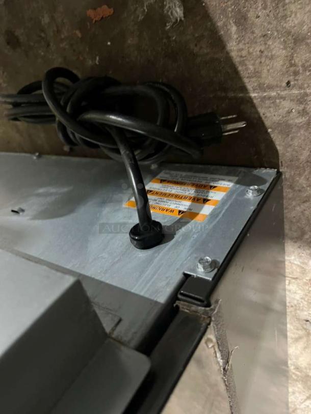 Manitowoc under counter ice maker, model UYGF0140A-161B, shown with power cord and warning label, 115V, 1 Phase.