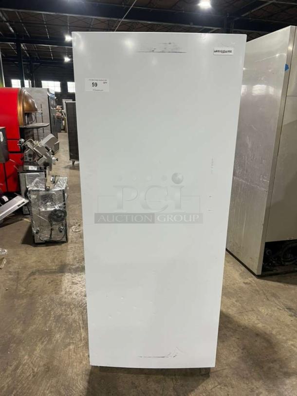 Frigidaire upright freezer, model FFFU16F2VW, 115V, white, free-standing, minor surface marks, visible Frigidaire logo.