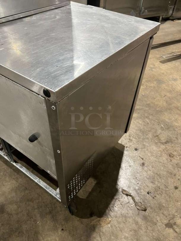 True TUC60 refrigerated 2-door lowboy cooler on casters, stainless steel, with worktop and underneath storage, 115V, 1 phase.