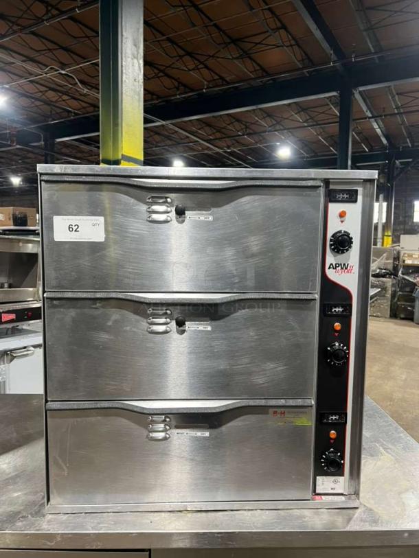 APW Wyott 3 Drawer Bread Warmer, stainless steel, 115V 1 Phase, undercounter/countertop model, visible control knobs.