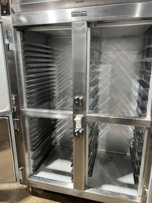 Traulsen 4 split door reach-in refrigerator, Model AHT2-32, with built-in pan racks, 115V, 1 phase, on legs, stainless steel.