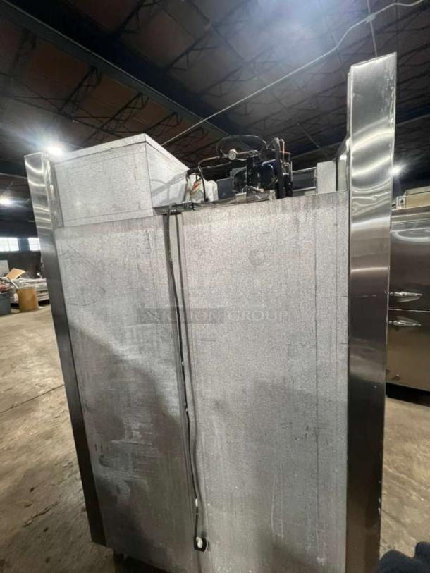 Traulsen AHT2-32 4 Split Door Refrigerator with built-in pan racks, 115V 1-phase, on legs, showing back and top components.