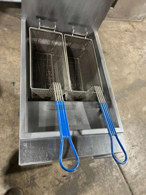 Vulcan stainless steel deep fat fryer, model 1VEG35M-1, with two baskets and blue handles, in good condition.