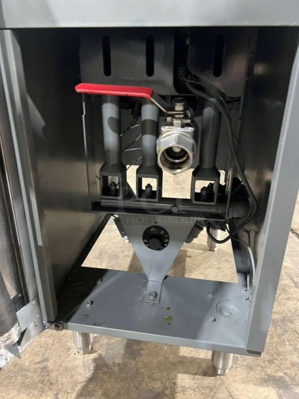 Vulcan stainless steel deep fat fryer model 1VEG35M-1, dual basket, on legs. Visible controls and connections. Good condition.