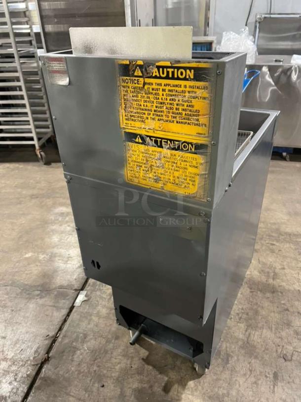 Vulcan stainless steel 2-basket deep fat fryer, model 1VEG35M-1, with caution labels. Serial DV-1081395HB. On legs.