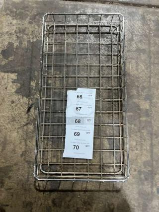 All stainless steel heavy duty bakery display basket with wire grid design, sturdy construction, and visible auction tags.