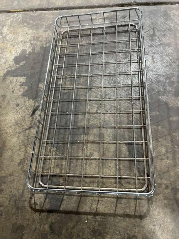 All stainless steel heavy-duty bakery display basket with grid design, in used condition, suitable for commercial use.