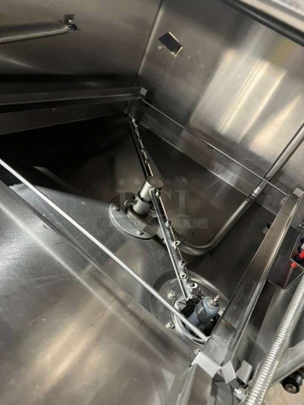 ADS ET-AF-M under-counter commercial dishwasher, stainless steel. Features visible spray arm and internal components. Model ETAF-M, serial 25857, 120V, 1-phase.