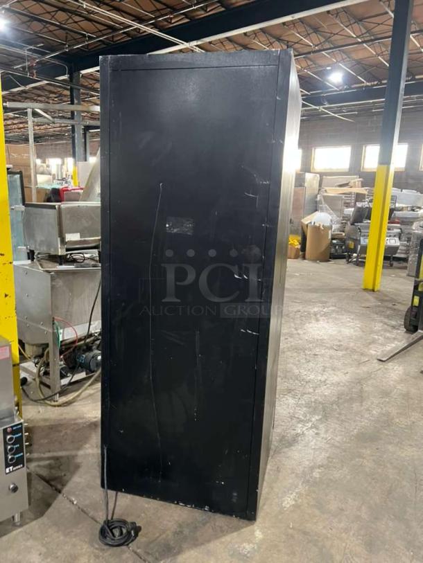 Habco ESM28 one-door reach-in cooler merchandiser in black, visible wear, 115V, 1 phase, model and serial labels included.