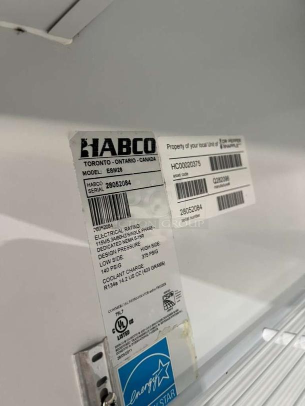 Habco ESM28 one door reach-in cooler merchandiser, serial 280520894, 115V, 1 phase, with Energy Star label and UL listing.