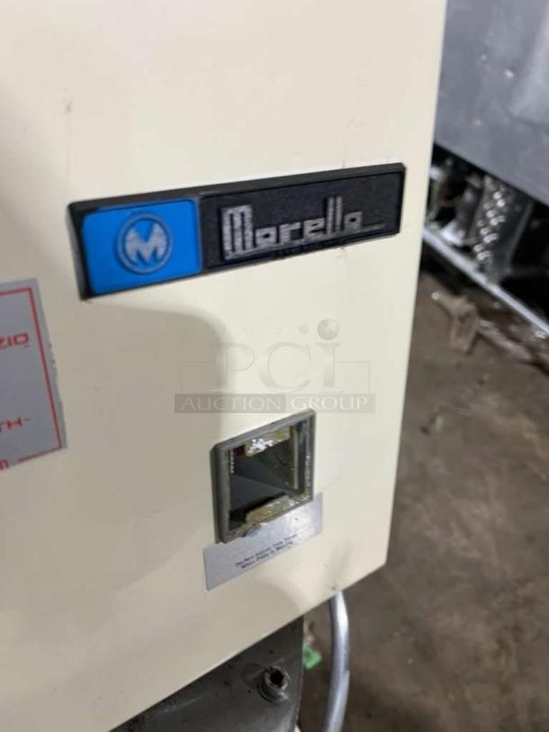 Morella electric dough press machine with brand logo. Appears in good condition. Includes identification markings and label.