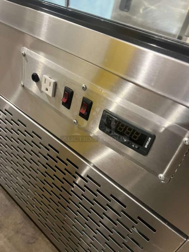 Custom Cool refrigerated bakery display case, stainless steel, with digital controls and switches, excellent condition.