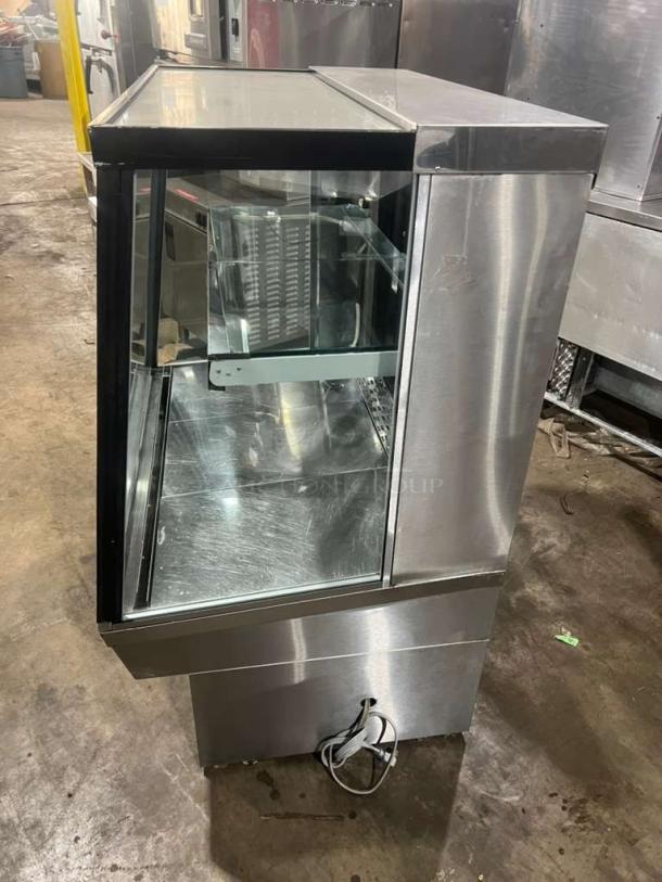 Custom Cool Refrigerated Bakery Display Case, stainless steel, glass front, excellent condition, visible power cord.