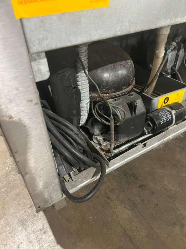 Fagor Model FUR27 lowboy/worktop cooler, stainless steel, on casters, 115V 1 Phase, visible wiring and components.