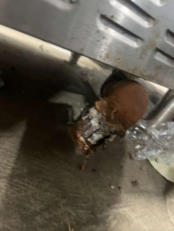 Cleveland Range model 24CEM24 convection steamer, showing a rusted pipe beneath the stainless steel compartment.