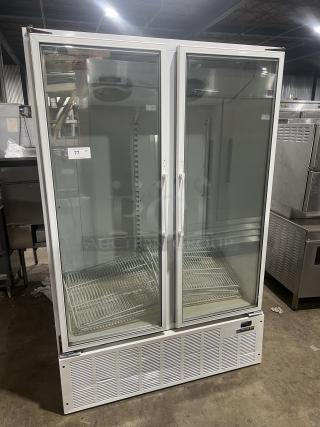 Master-Bilt BLG48HD commercial freezer with white finish, two glass doors, poly coated wired racks. Model SN: 022414, 115V 1 Phase.