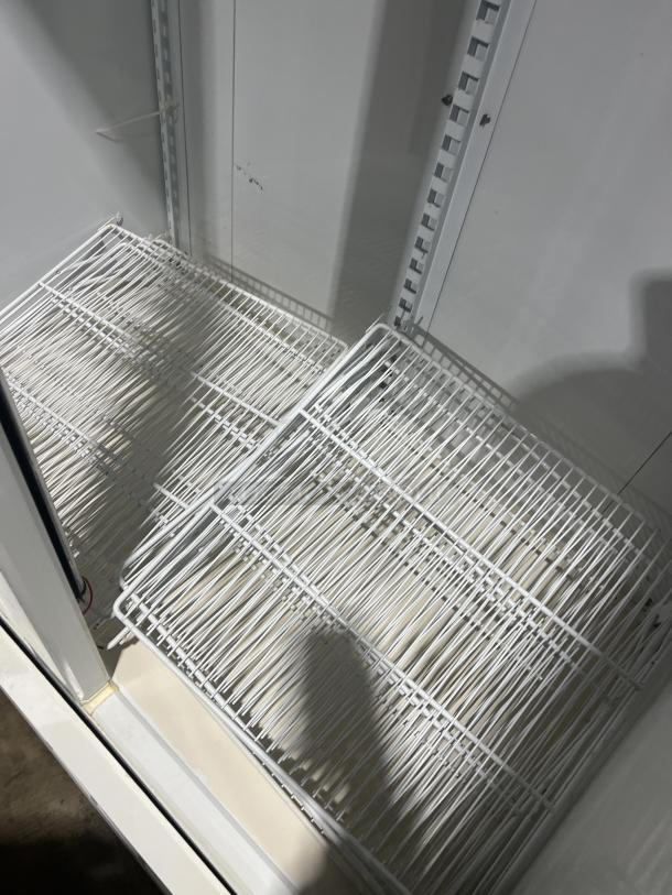 Master-Bilt BLG48HD commercial freezer, white, dual glass doors, poly-coated wired rack; 115V, 1 phase, excellent condition.