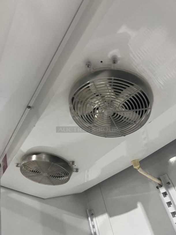 Master-Bilt BLG48HD freezer interior, showing two cooling fans, poly-coated wired rack, and white finish. 115V, 1 phase.