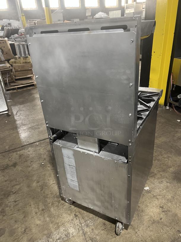 American Range 4-burner commercial stainless steel gas range/oven combo with backsplash, salamander shelf, wired rack, and casters.