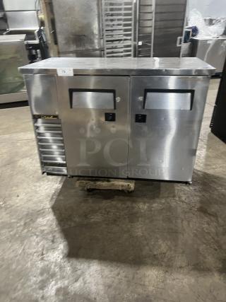 True Commercial Stainless Steel 2-Door Back Bar Cooler, Model TBB-24-48S, with black-coated wire rack, used condition.