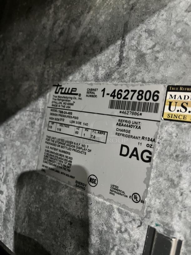 True commercial stainless steel 2-door back bar cooler. Model TBB-24-48S, SN 1-4627806, 115V, 1 Phase. Features black coated wire rack, NSF certified.