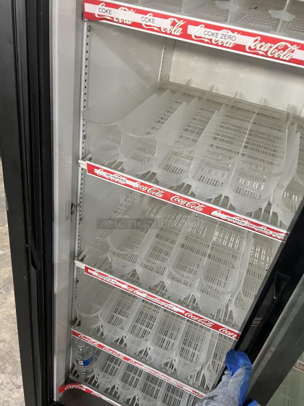 True GDM-37 Coca-Cola style reach-in merchandiser fridge, double glass sliding doors, poly-coated wired racks, good condition.