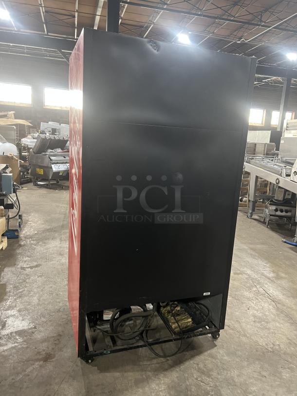 True GDM-37 Coca-Cola style double glass sliding door refrigerator on casters, with poly coated wired rack, 115V, 1 phase.