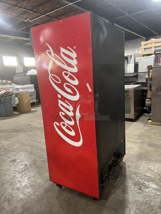 True GDM-37 Coca-Cola style reach-in refrigerator with double glass sliding doors, poly coated racks, and casters.