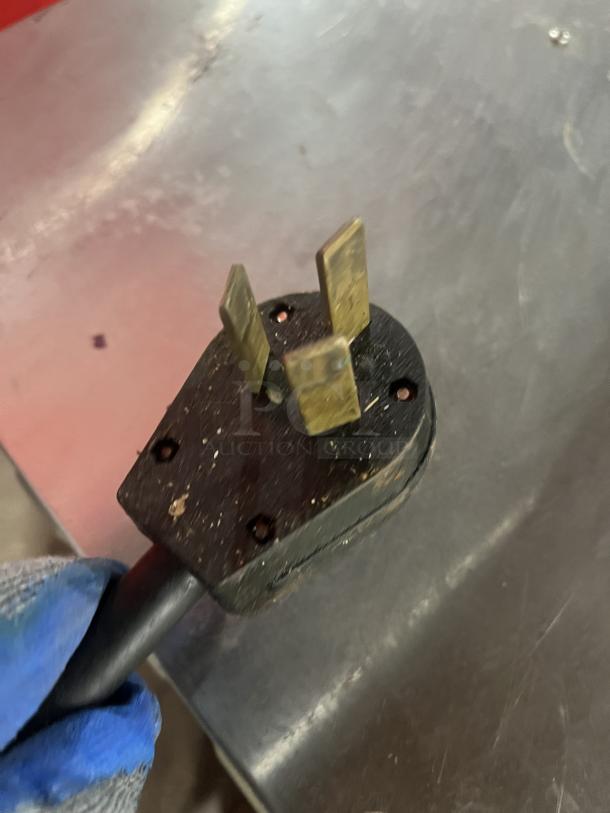 Close-up of a plug for a Perfect Fry commercial stainless steel countertop electric deep fryer, Model PFC570, 240V 1 Phase.