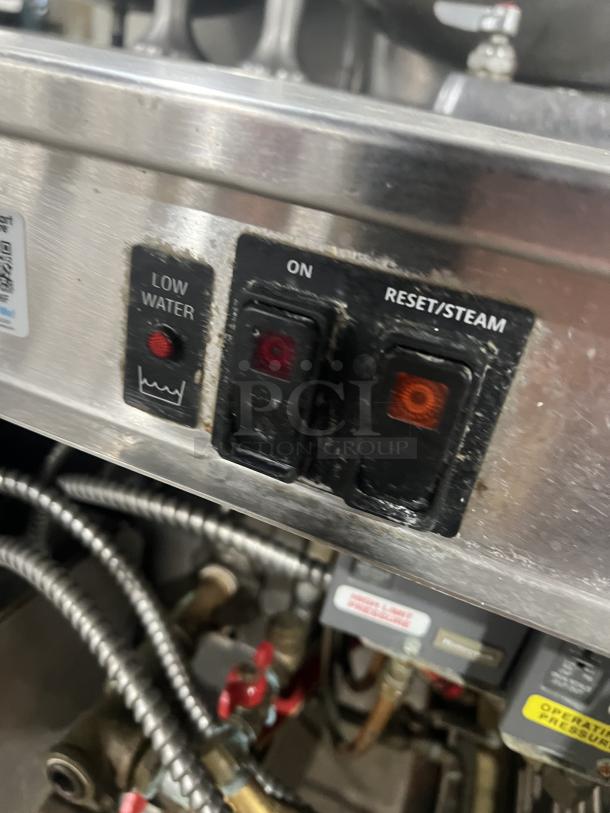 Cleveland Range stainless steel generator controls section, with "Low Water," "On," and "Reset/Steam" switches, part of model 36GMK1010300.