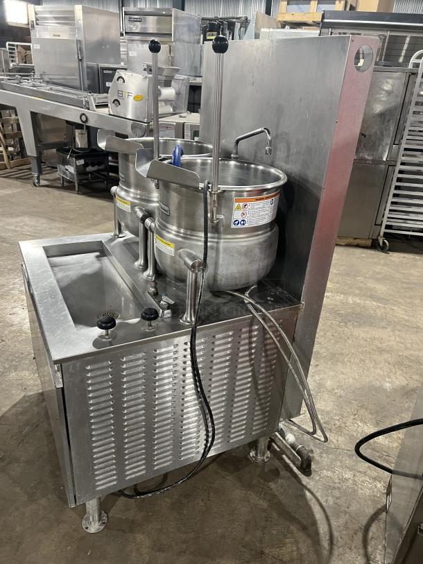 Cleveland Range stainless steel 10-gallon tilting steam kettles, model 36GMK1010300, 115V, on legs, with modular generator base.