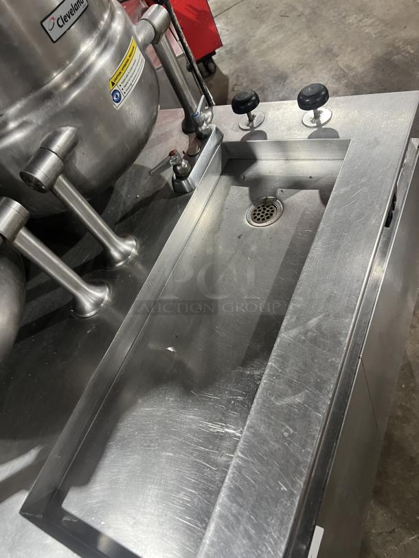 Cleveland Range stainless steel 10-gallon tilting steam kettles, model 36GMK1010300, with generator base.