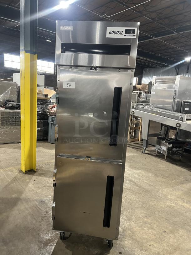 Delfield stainless steel half-door refrigerator, model 6000XL, with wired rack, on casters, SN: 0912152000020.