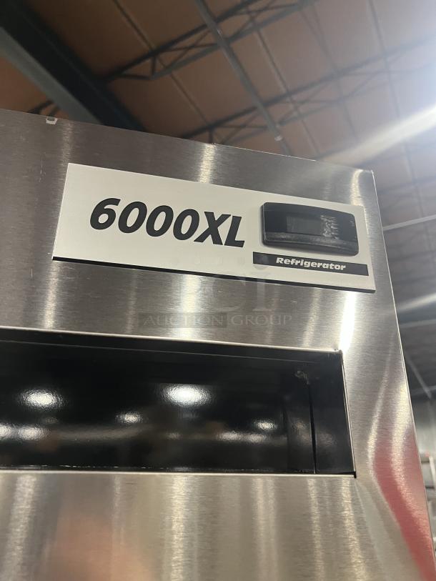 Delfield stainless steel half-door single section reach-in refrigerator, model 6000XL, with wired rack and casters.